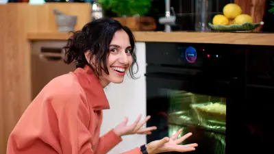 Woman next to a smart oven